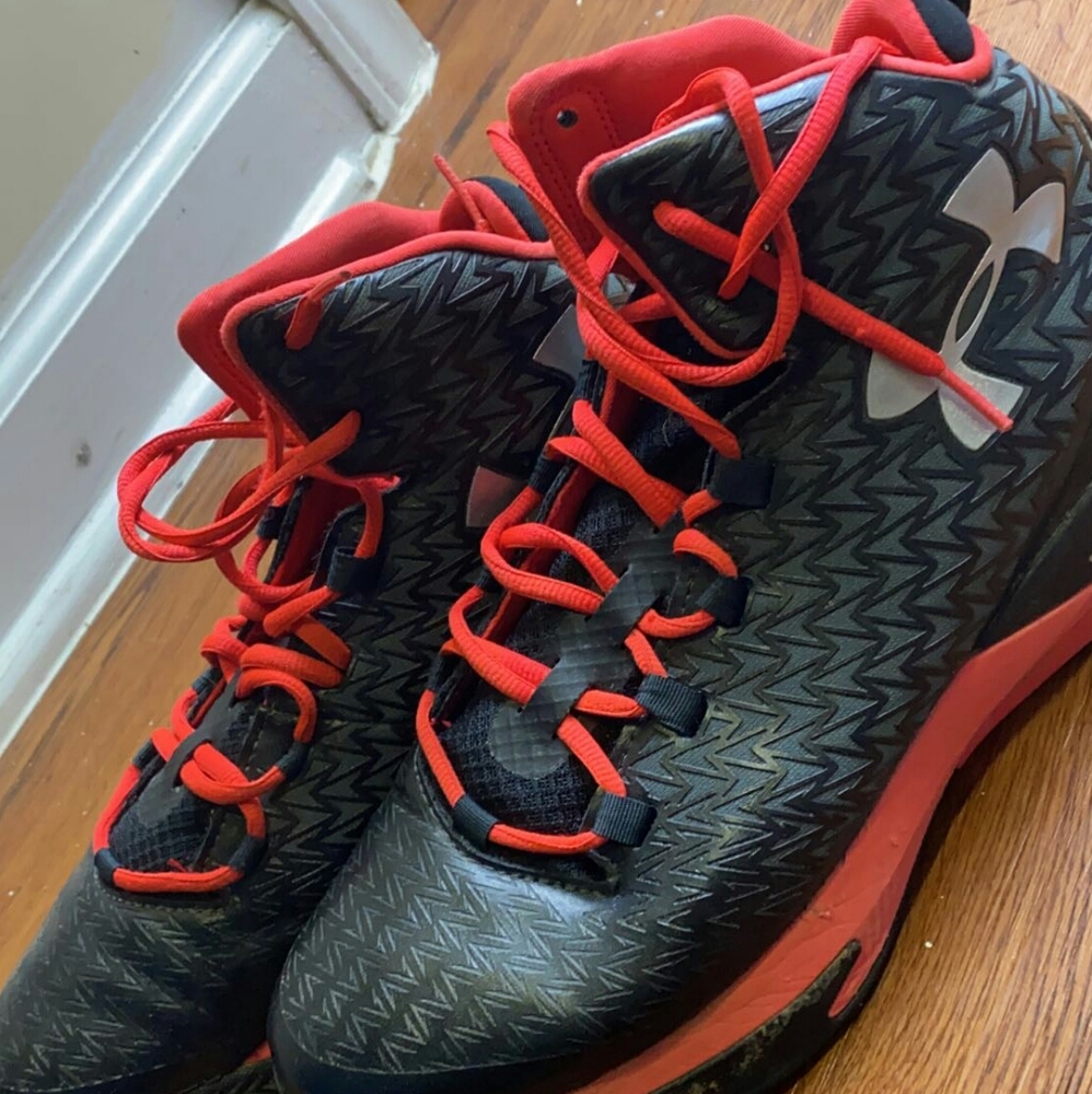 Red and black under armour shoes